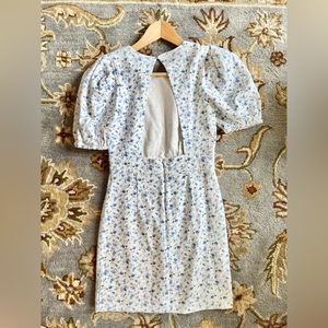 Backless white denim dress with floral detailing